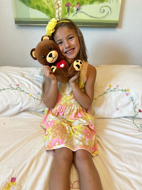 Child posing with the bear